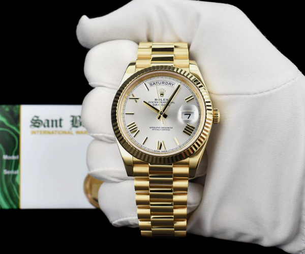 ROLEX 18kt Gold Day Date 40 President Silver Roman Model 228238