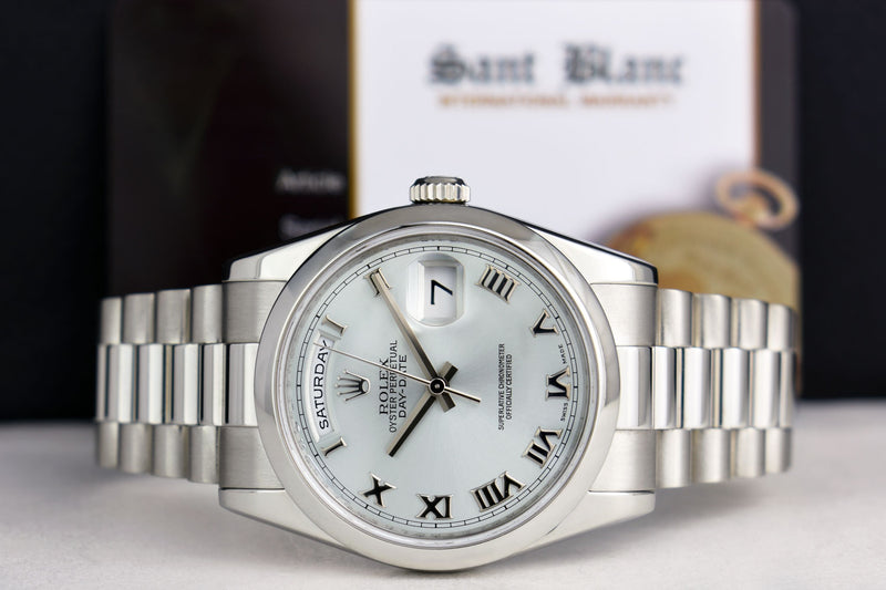 ROLEX REHAUT Mens Platinum President Day Date Bold Roman Dial Model 118206