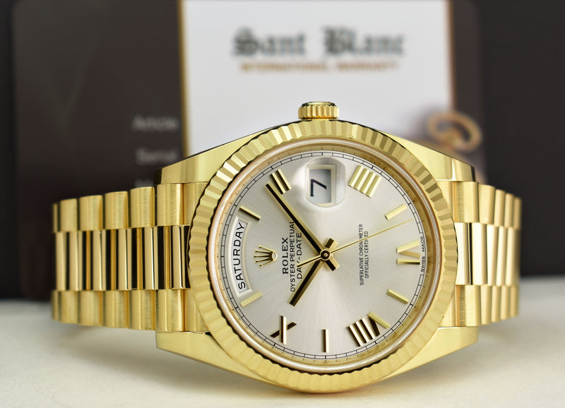 ROLEX 18kt Yellow Gold Day Date 40 President Silver Roman Dial Model 228238