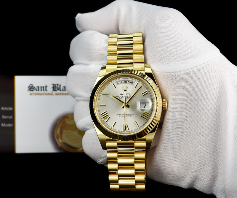 ROLEX 18kt Yellow Gold Day Date 40 President Silver Roman Dial Model 228238